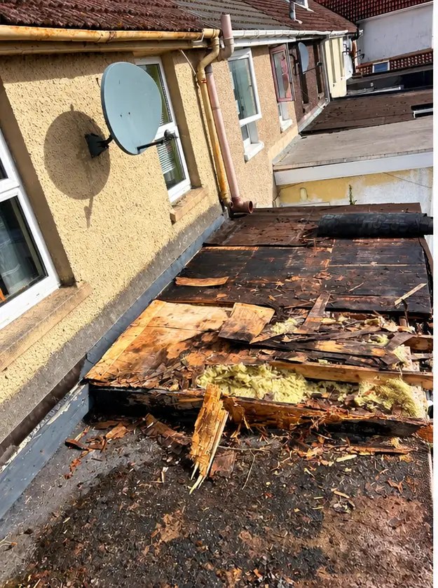 Flat roof before refurbishment — deteriorated existing roof materials being removed