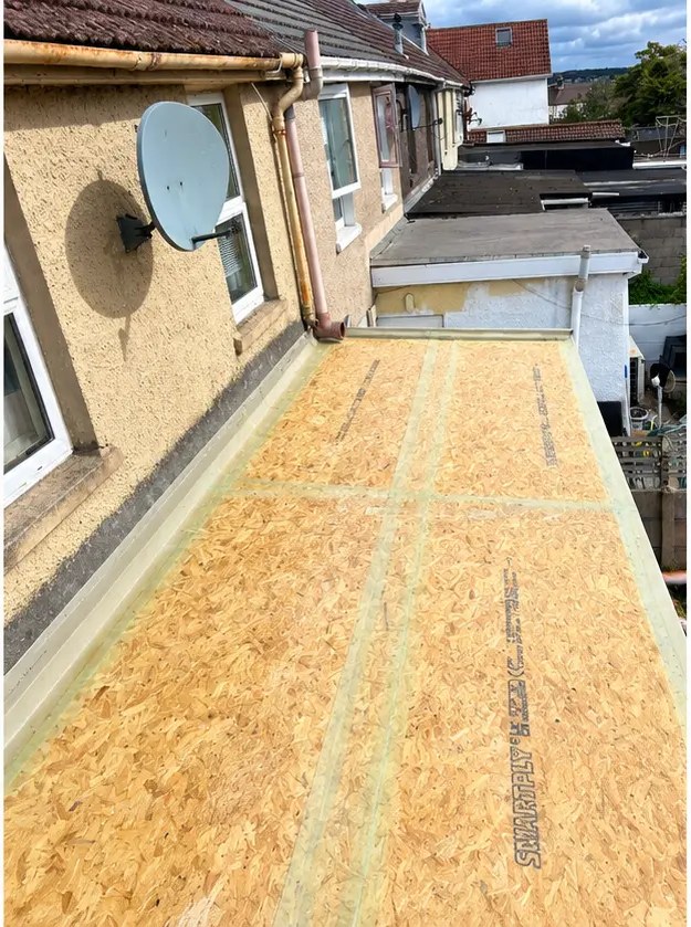 Flat roof during refurbishment — new roof decking installed by A&C